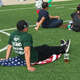 Illustration for article titled Jets Fan Who Stands For National Anthem Sits On American Flag